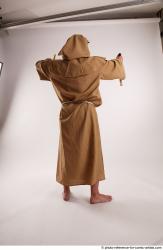 JOEL_ADAMSON WITH CRUCIFIX AND SWORD